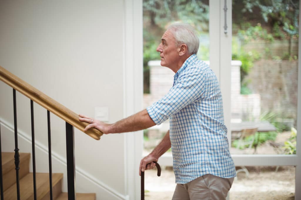 Senior man going up the stairs